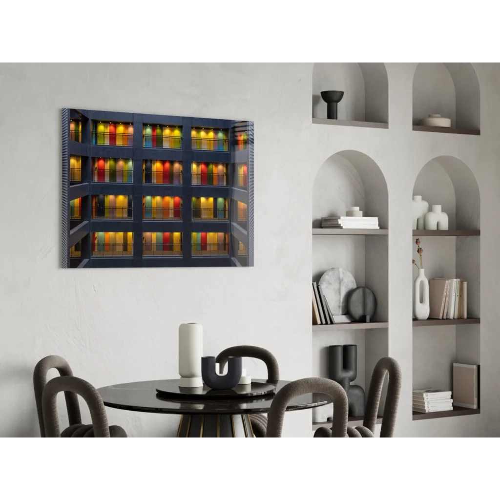 Modern glass wall art of illuminated rainbow building on white wall