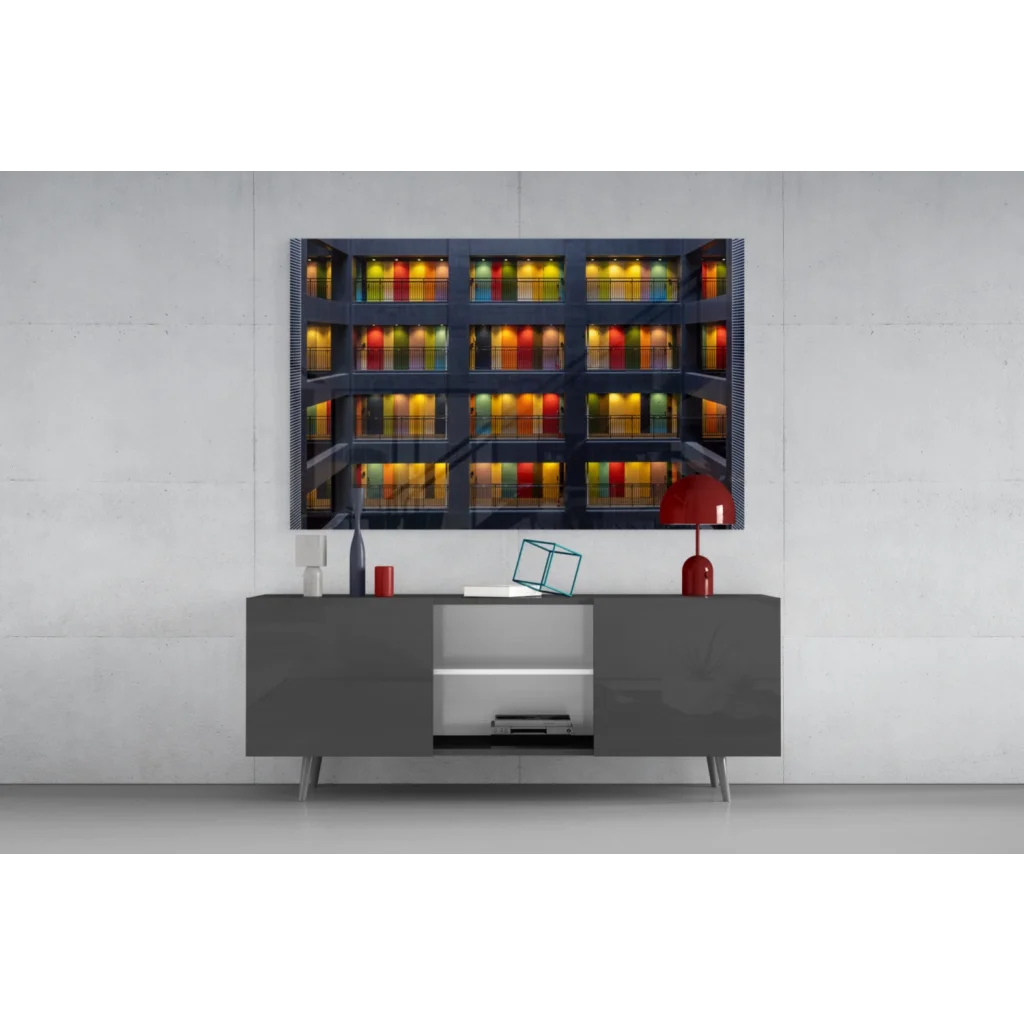 Modern gray console table under rainbow glass wall art of illuminated buildings