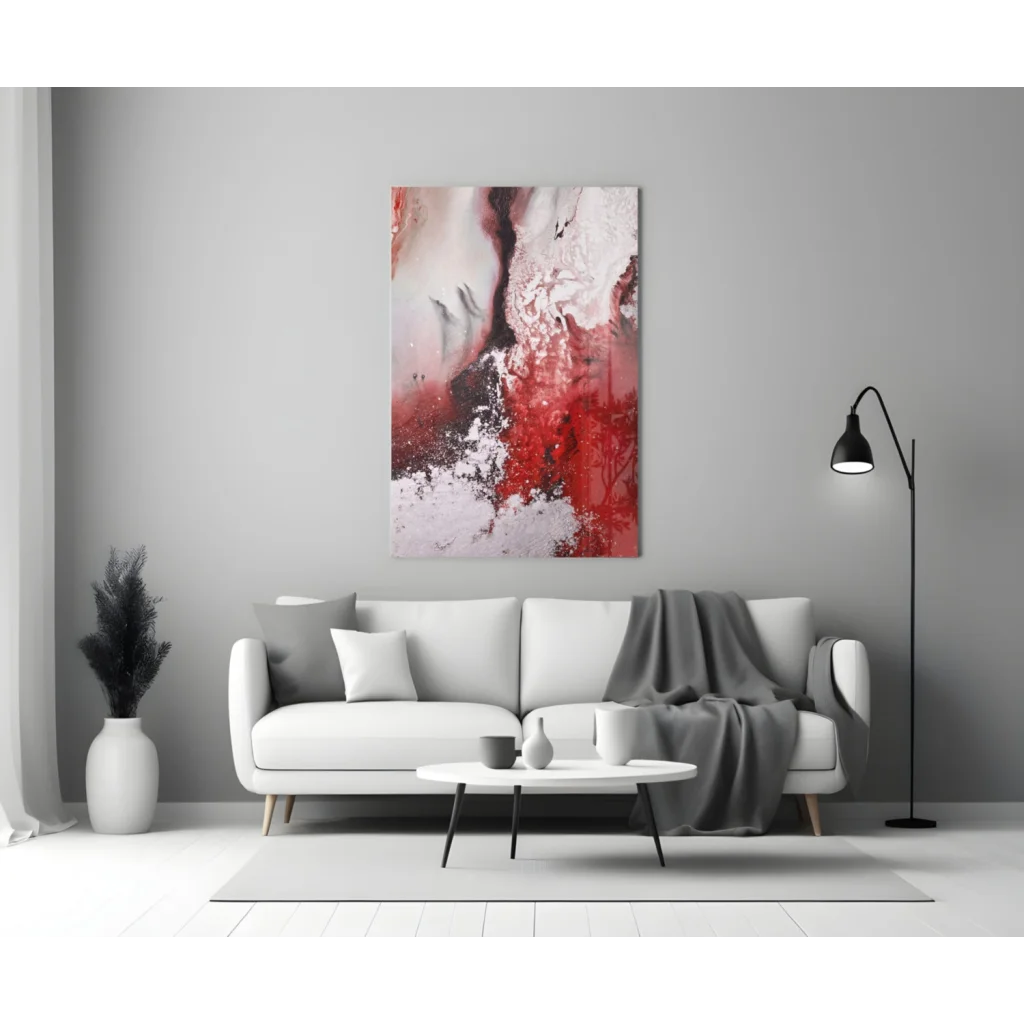 Bold red swirl glass wall art with glitter accents above modern sofa