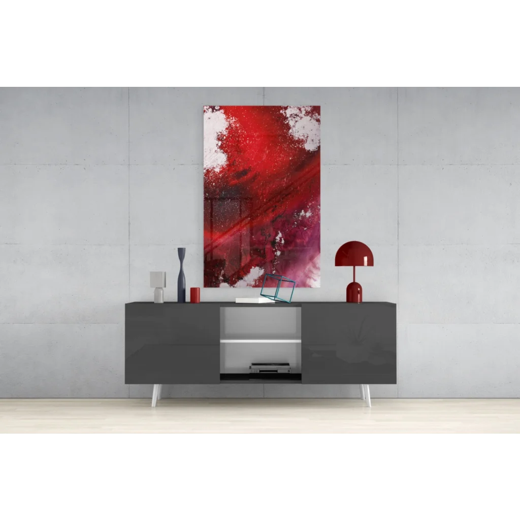 Vibrant red and white abstract glass wall art above gray console