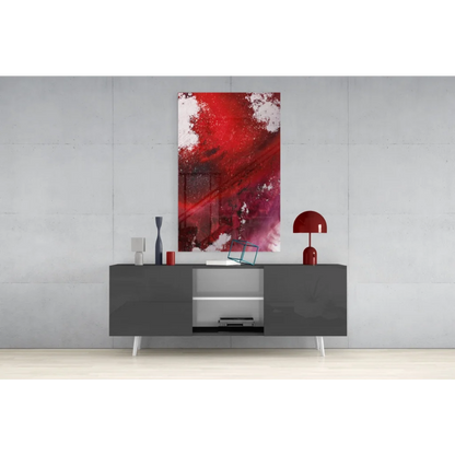 Vibrant red and white abstract glass wall art above gray console