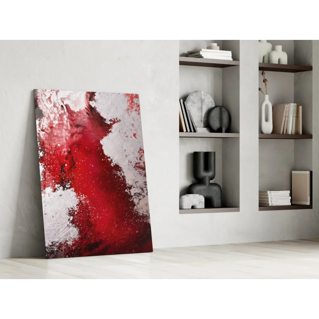 Vibrant red abstract glass wall art with textured splashes on minimalist wall