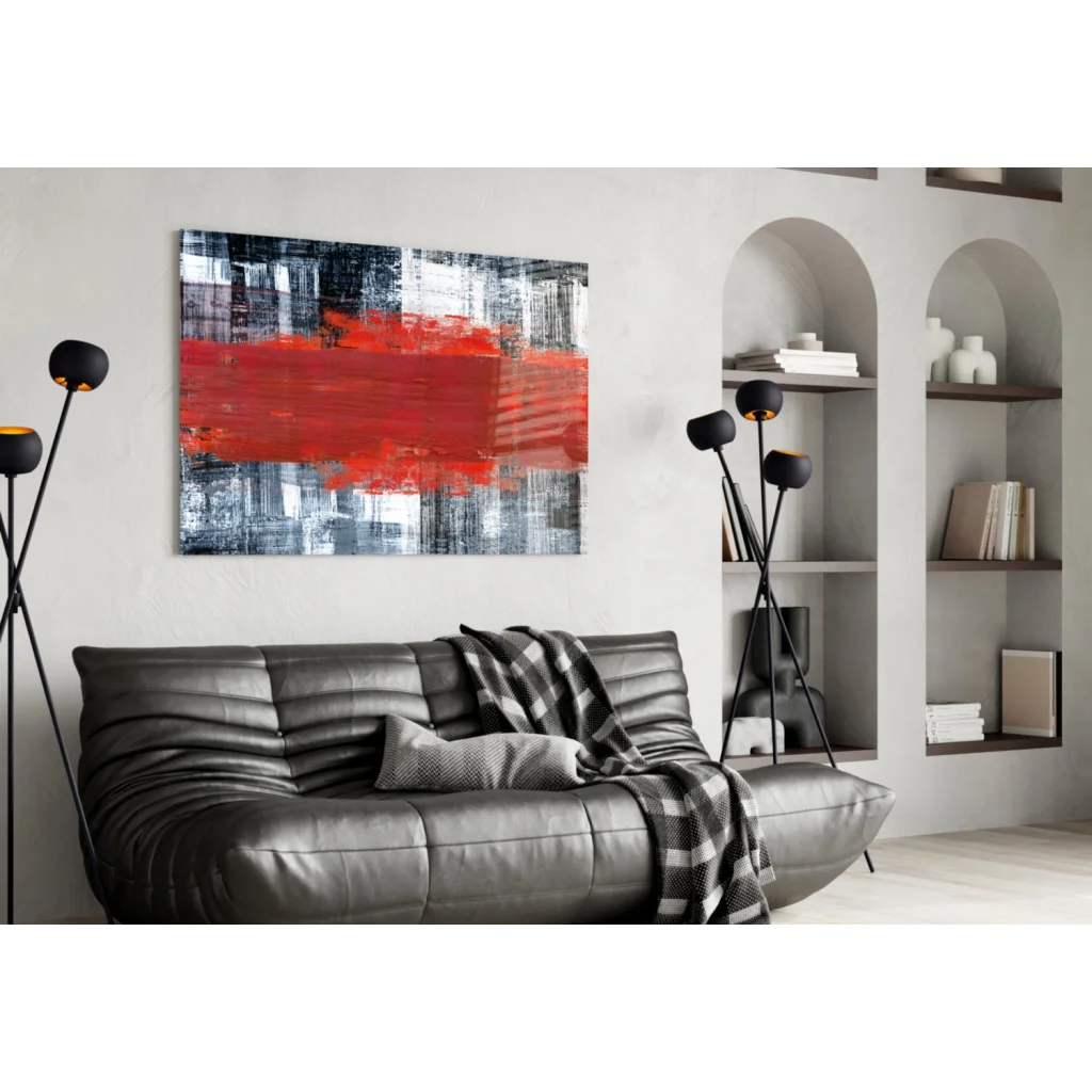 Bold red stripe abstract canvas wall art above sleek leather sofa