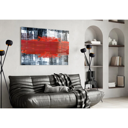 Bold red stripe abstract canvas wall art above sleek leather sofa