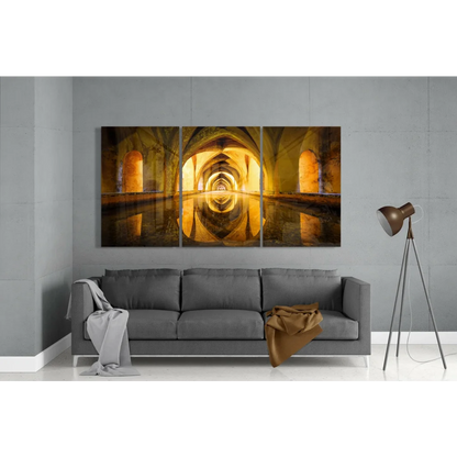 Golden arched tunnel three panel canvas wall art with water reflection