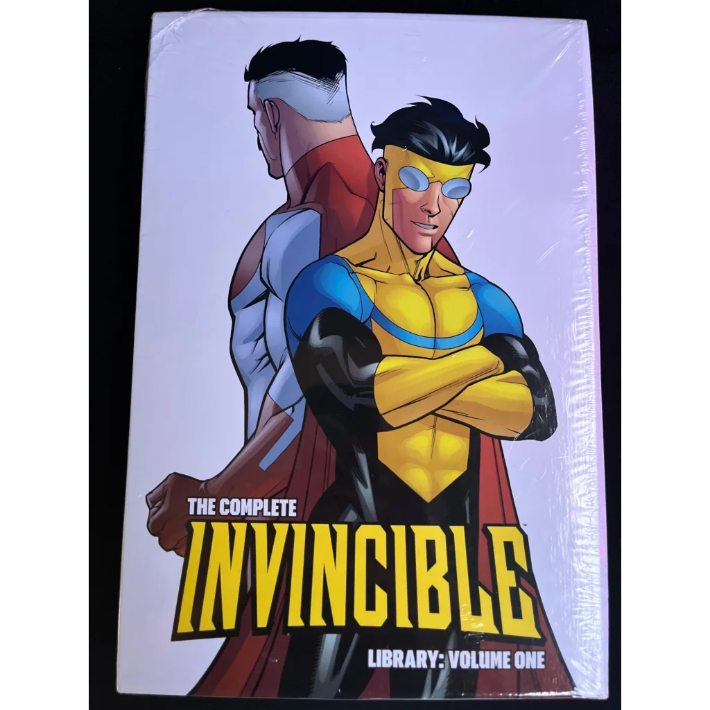 Hard cover Complete Invincible Library with two superhero on the cover of Invincible Library Volume One
