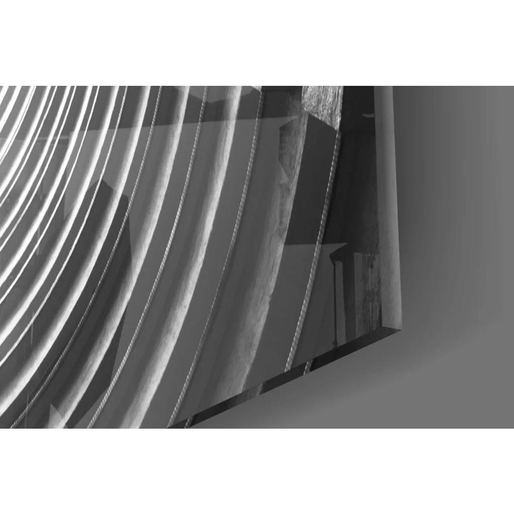 Abstract black-and-white glass wall art with concentric circles and bright light center