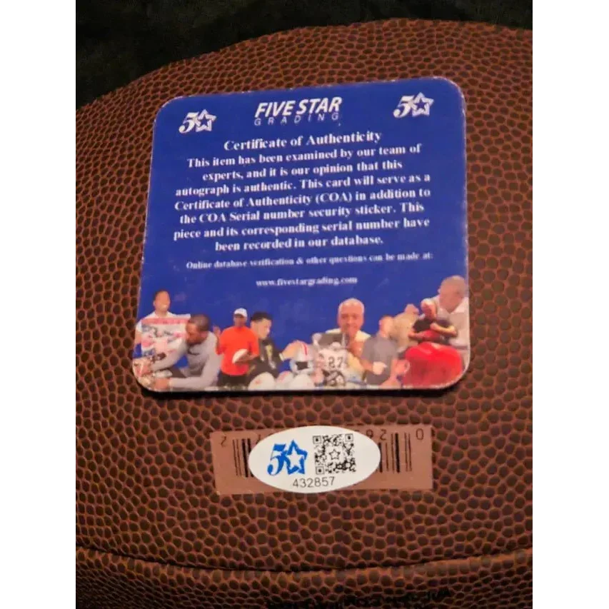 Authenticity card and serial sticker for Cooper Kupp signed autographed football
