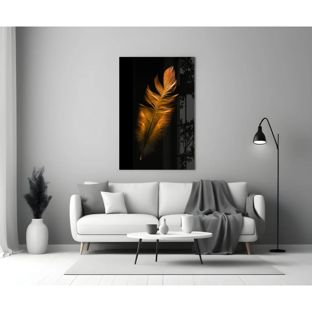 Stunning golden feather glass wall art on black canvas above white sofa
