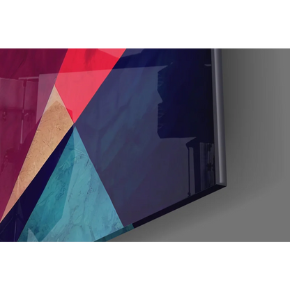 Sleek modern TV framing bold geometric glass wall art in red, teal, gold