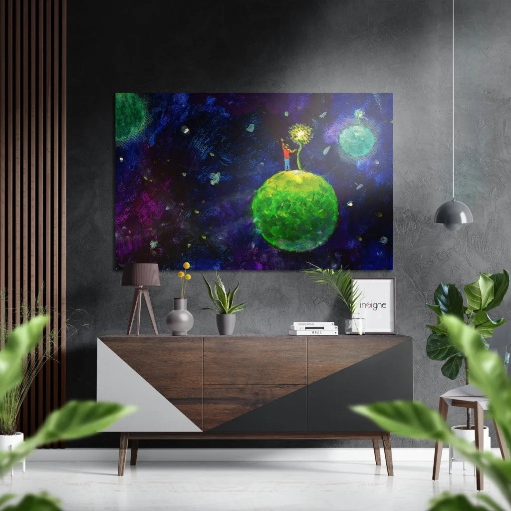 Vibrant cosmic print on brushed aluminium dibond: glowing green planet with figure in starry purple galaxy