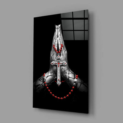 Striking black-and-white praying hands wall art with silver cross and red beads
