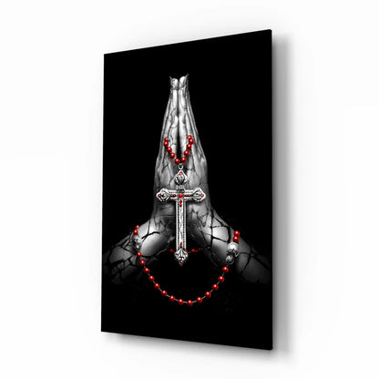 Striking black-and-white praying hands wall art with silver cross and red beads