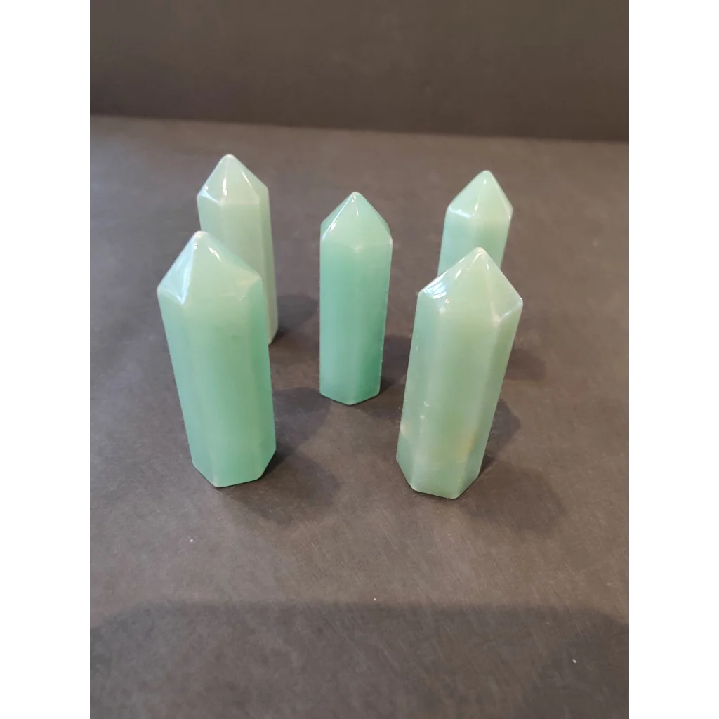 Set of five translucent mint-green crystal cut base tower sculptures