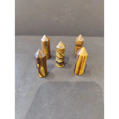 Five tiger eye crystal cut base tower sculptures in golden-brown stripes