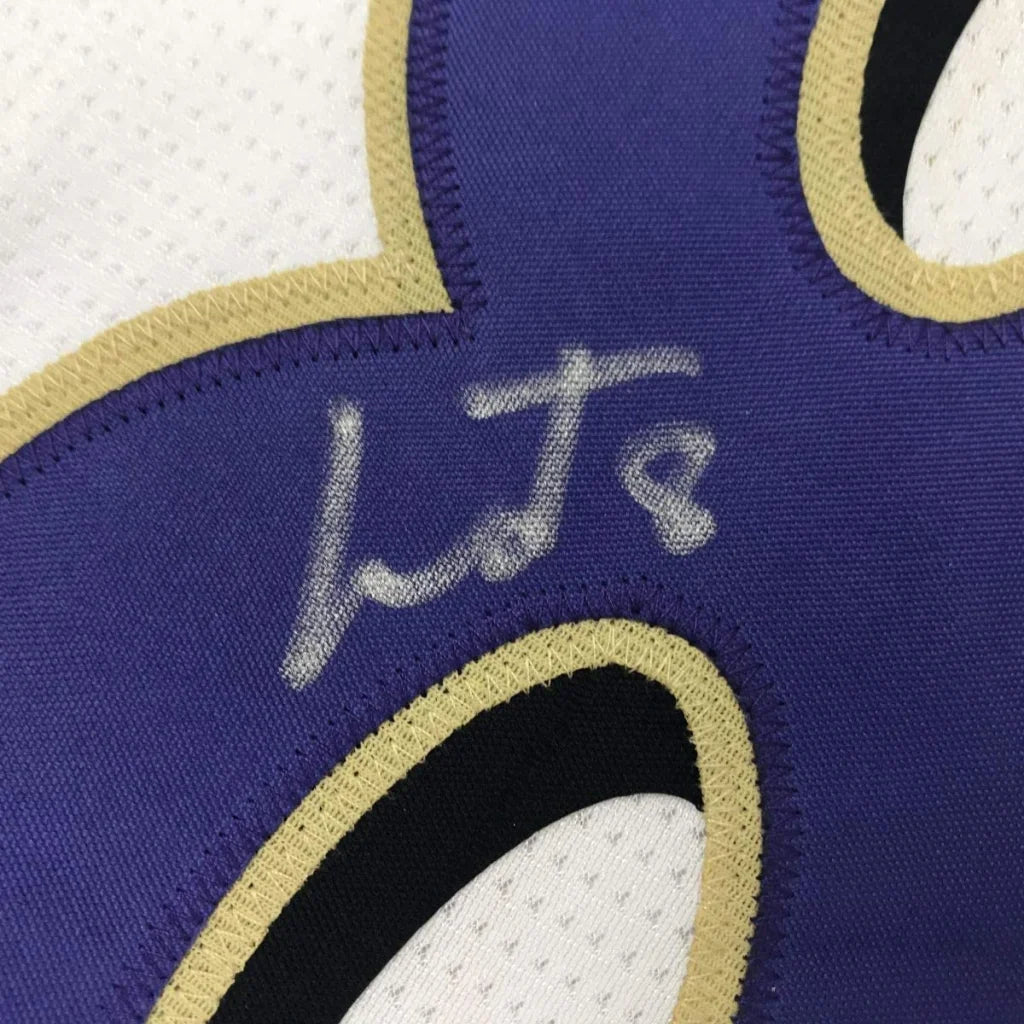 Autographed purple and gold custom jersey from professional sports league