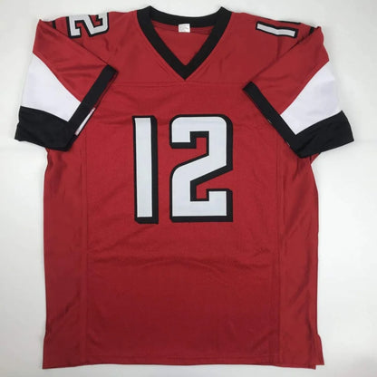 Red custom jersey with number 12, black V-neck, perfect for sports league fans