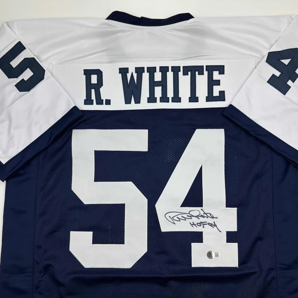 Autographed navy blue and white football jersey with number 54, perfect for professional sports fans