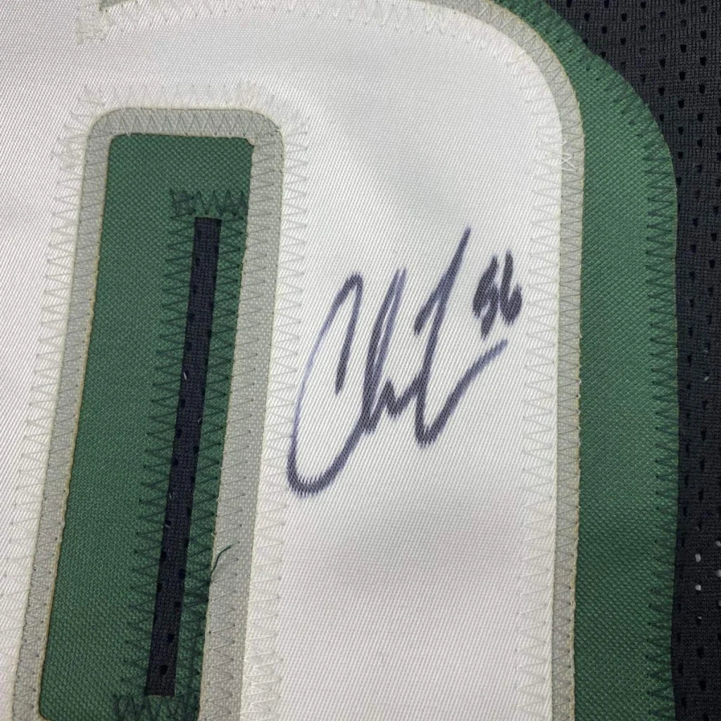 Autographed black and green custom jersey with stitched numbers for professional sports fans