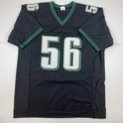 Black and green custom jersey with number 56 from a professional sports league