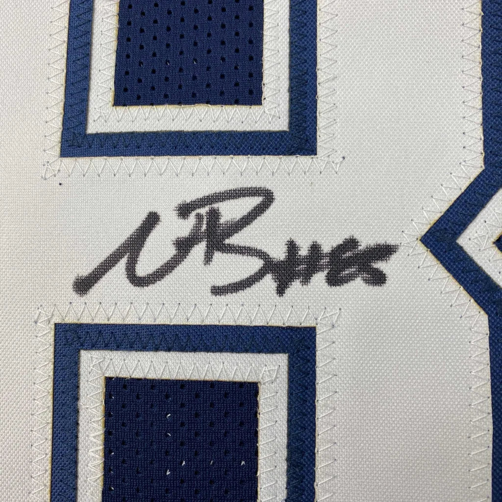 Autographed Dallas Cowboys blue football jersey with stitched numbers, perfect for sports fans