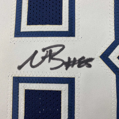Autographed Dallas Cowboys blue football jersey with stitched numbers, perfect for sports fans