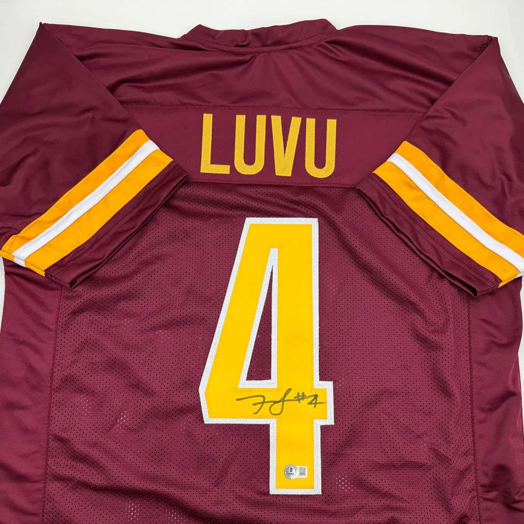 Autographed maroon and gold custom jersey with yellow 4 and Luvu nameplate
