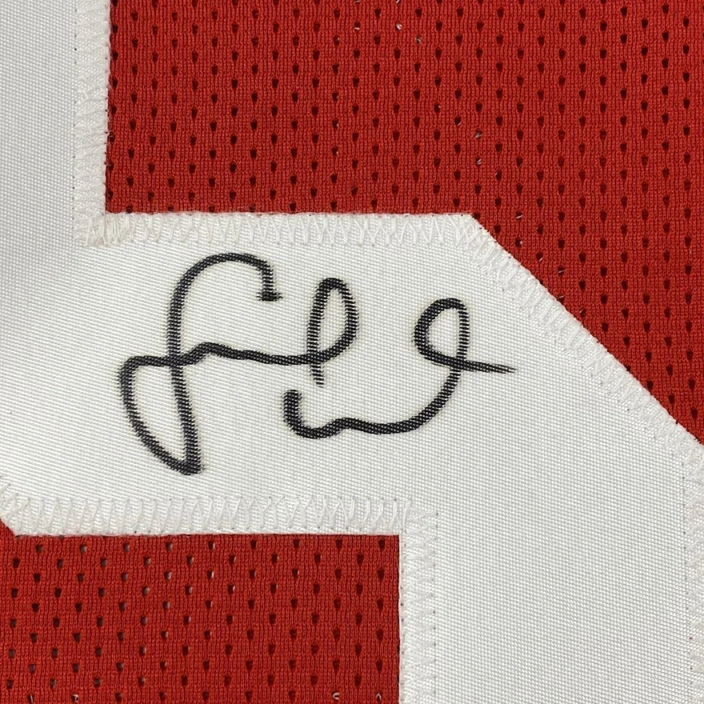 Red and white custom jersey with black autograph, number 54