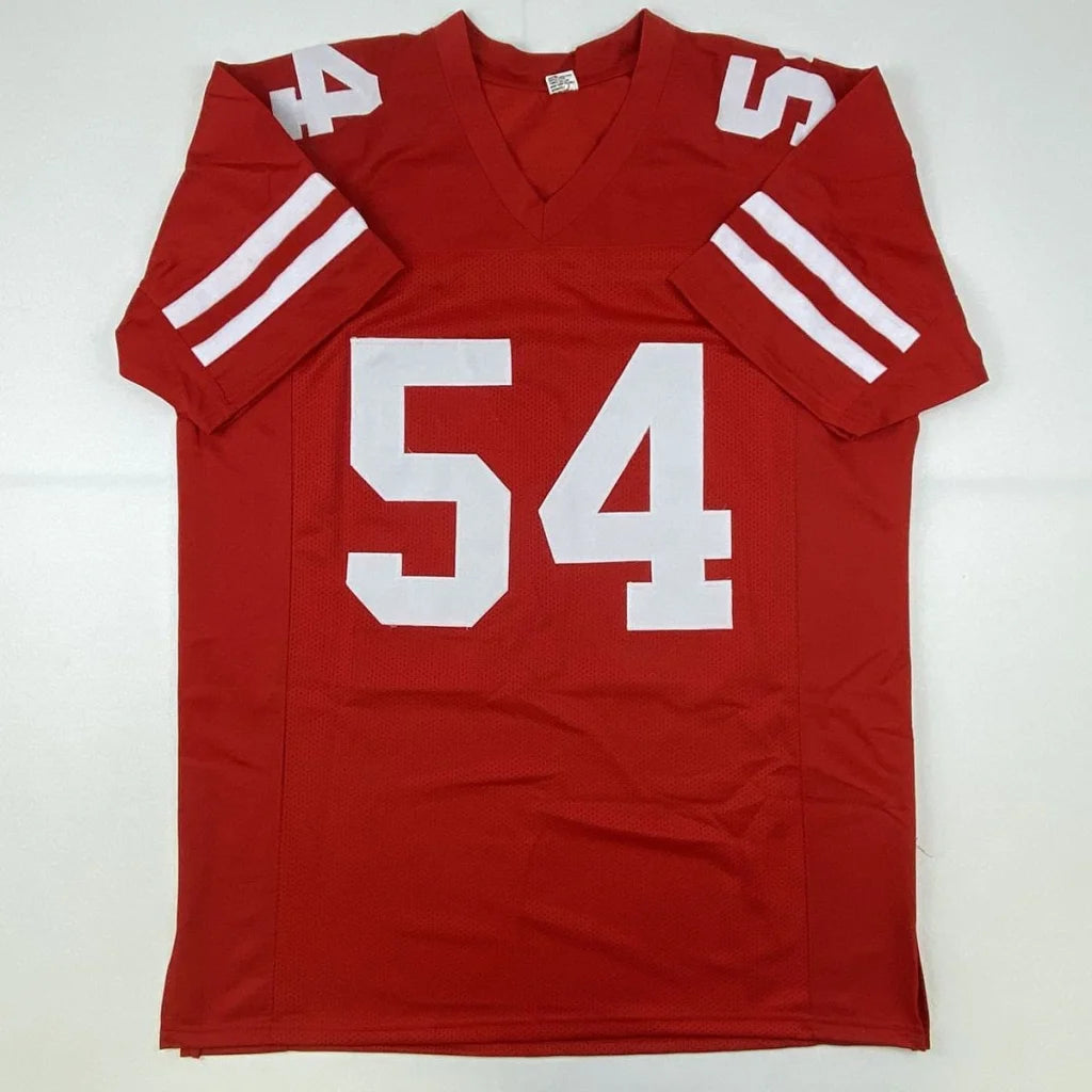 Red custom jersey with white numbers and stripes, autographed pro sports collectible