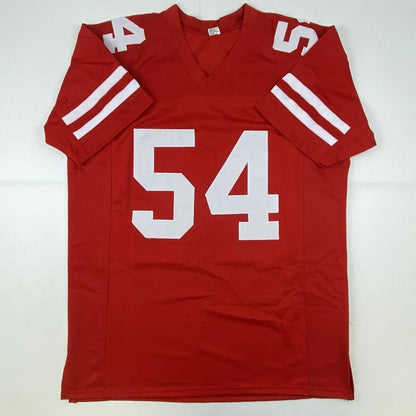Red custom jersey with white numbers and stripes, autographed pro sports collectible
