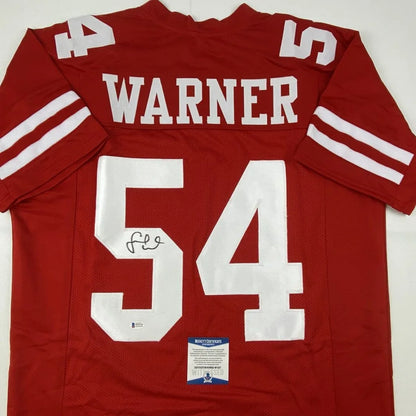 Red custom jersey with Warner 54, autographed pro sports league collectible
