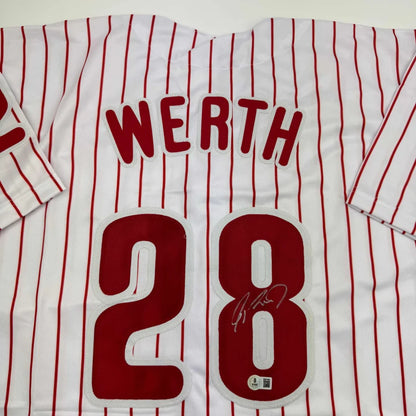Autographed custom jersey with red pinstripes, number 28, professional sports collectible