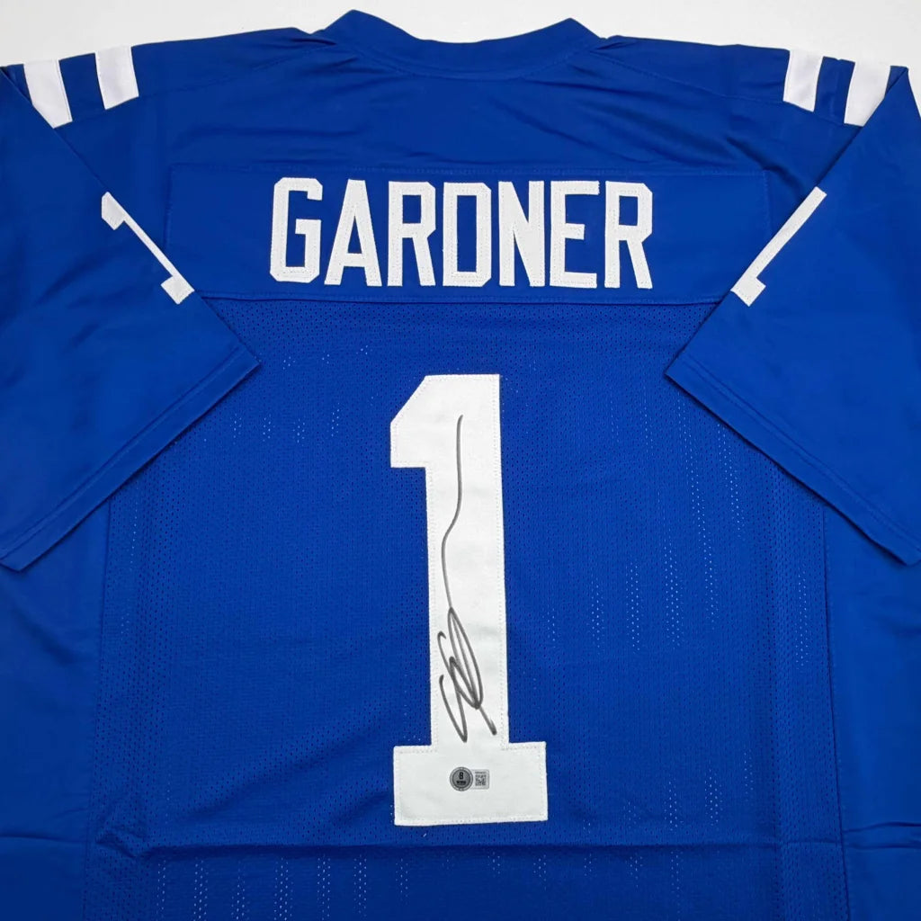 Custom blue football jersey with white numbers and pro signature
