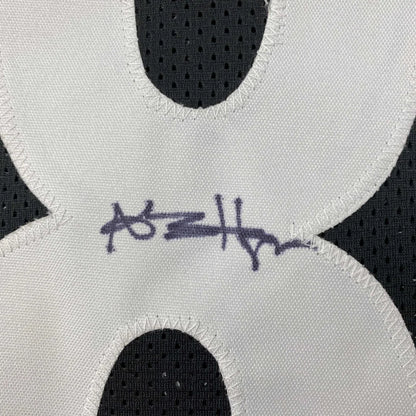 Autographed white fabric numeral on black mesh professional sports league custom jersey