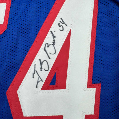 Blue custom jersey with white and red number 4 and autograph from a professional sports league
