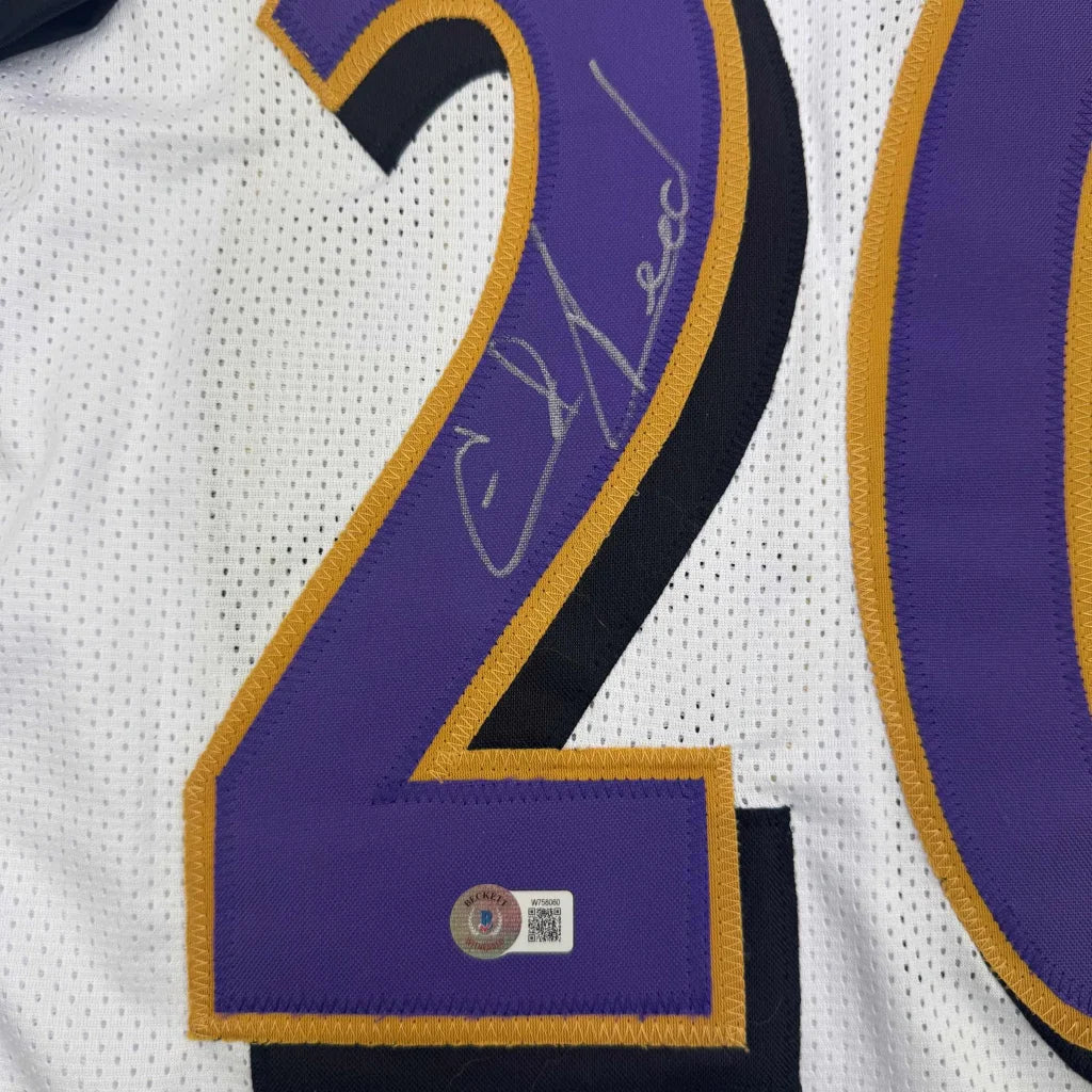 Autographed white custom jersey with purple and gold numbers for professional sports fans