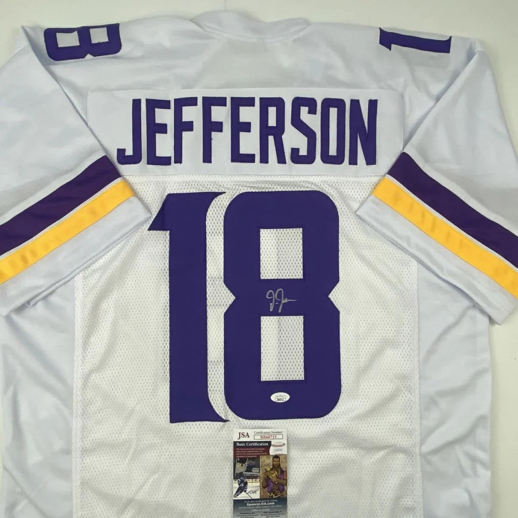 Autographed white football jersey with purple and gold accents from the Custom Jersey Collection featuring JJ and Jefferson, perfect for sports league fans