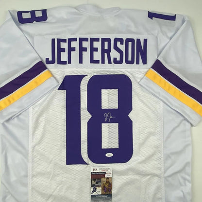 Autographed white football jersey with purple and gold accents from the Custom Jersey Collection featuring JJ and Jefferson, perfect for sports league fans
