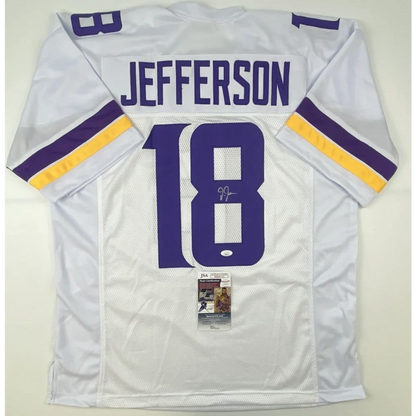White and purple custom jersey with Jefferson autograph and JSA tag from professional sports league