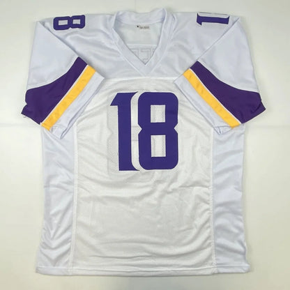 White custom jersey with purple and gold stripes and number 18 from professional sports league