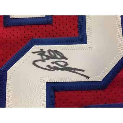 Red custom jersey with blue white numbers and black autograph for professional sports league