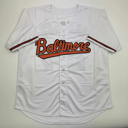White custom jersey with Baltimore in orange and black for professional sports fans