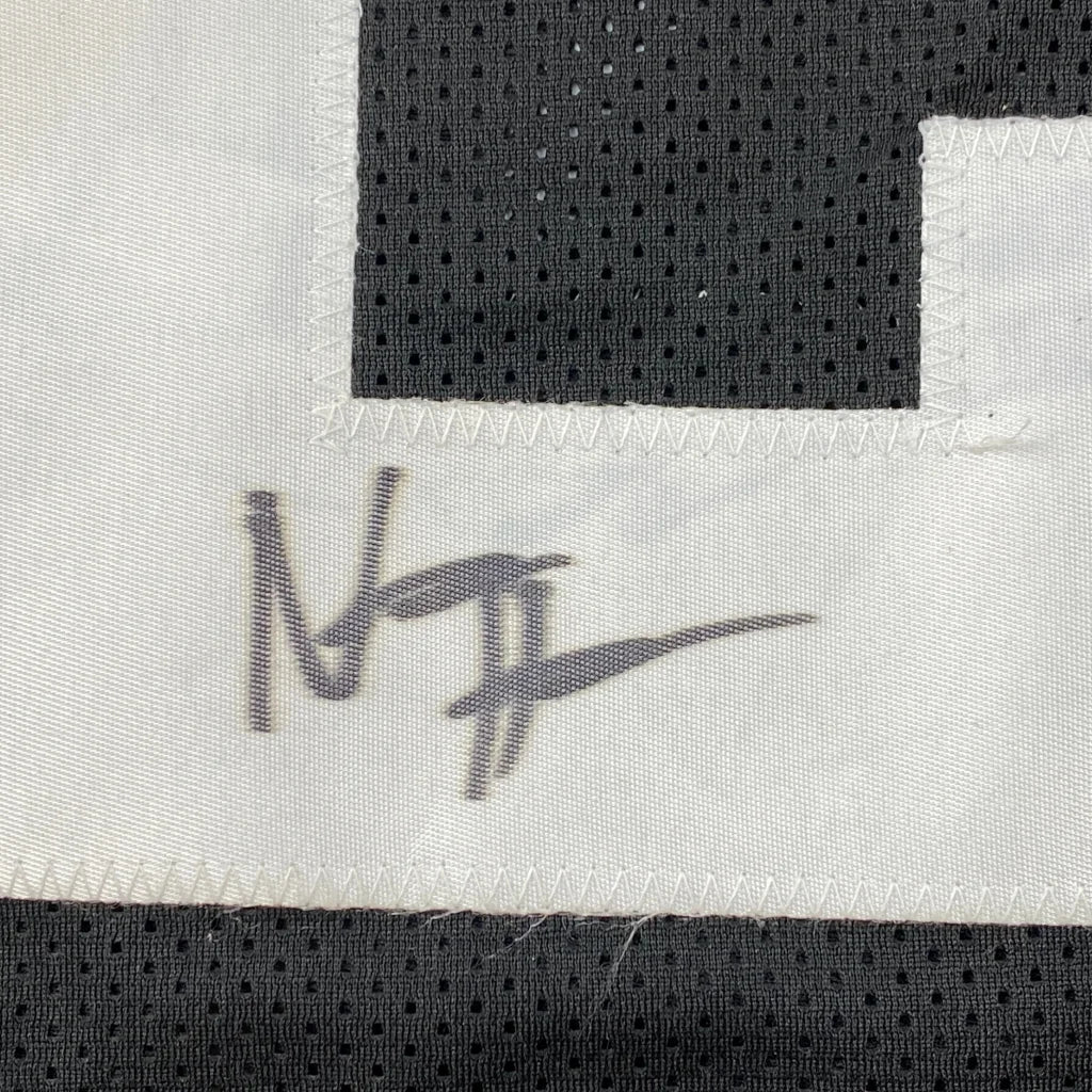 Autographed black and white custom jersey from Harris 22, a pro sports league collectible
