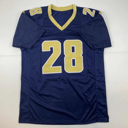 Navy blue custom jersey with gold trim and number 28 from professional sports league