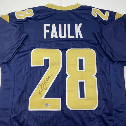 Autographed Marshall Faulk #28 football jersey in a custom jersey sports collectible