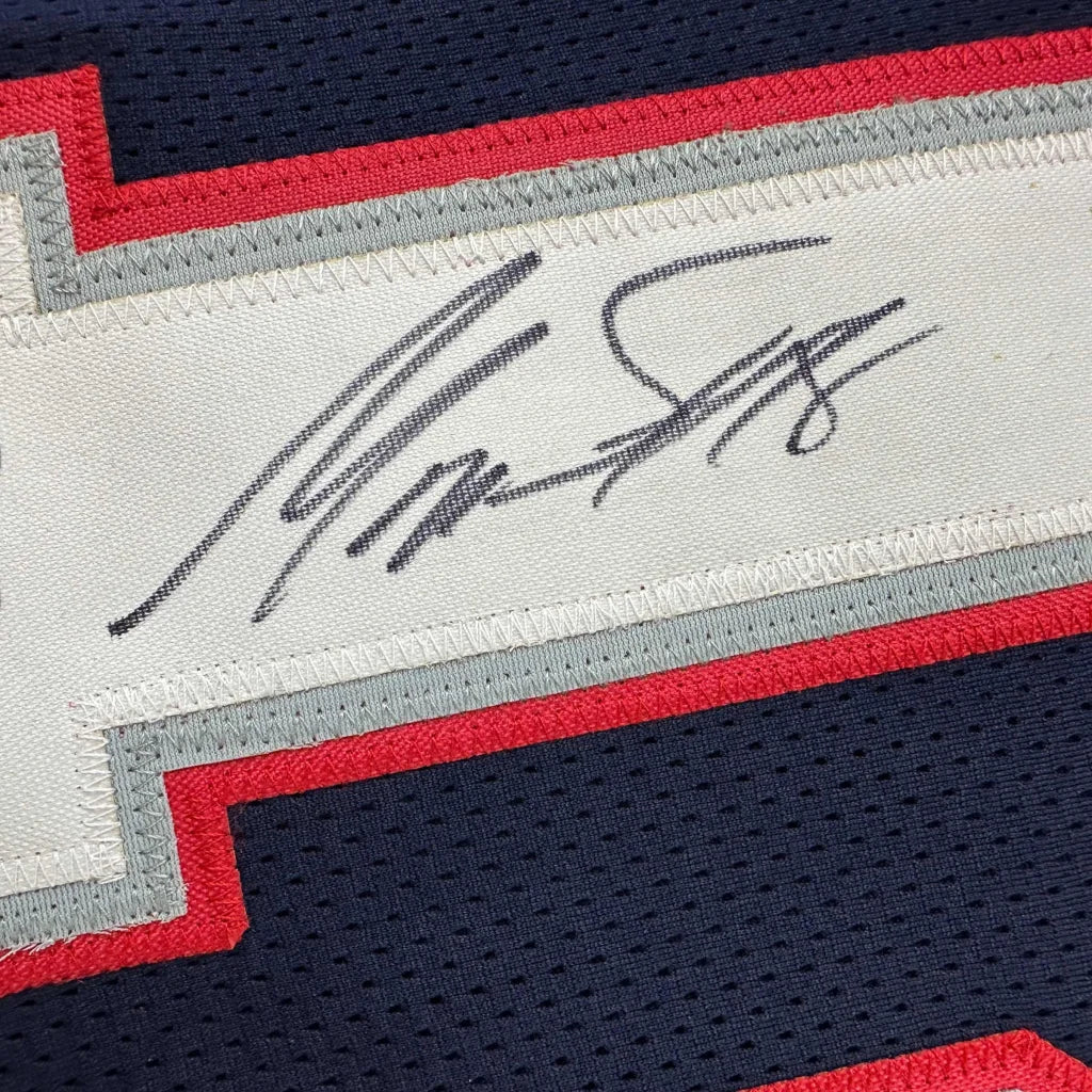 Autographed navy blue football jersey from a professional sports league perfect as a custom jersey collectible