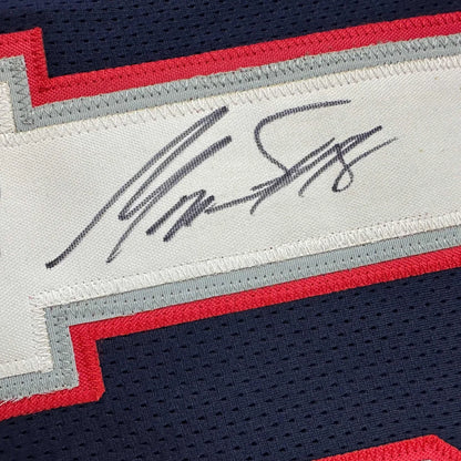 Autographed navy blue football jersey from a professional sports league perfect as a custom jersey collectible