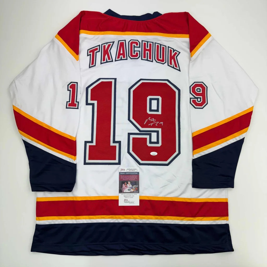 White, red, and blue custom jersey with number 19 signed by a pro sports athlete