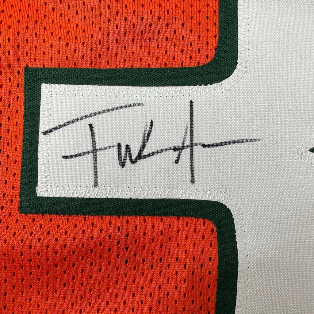 Autographed orange and white custom jersey from a professional sports league collectible