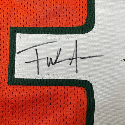 Autographed orange and white custom jersey from a professional sports league collectible